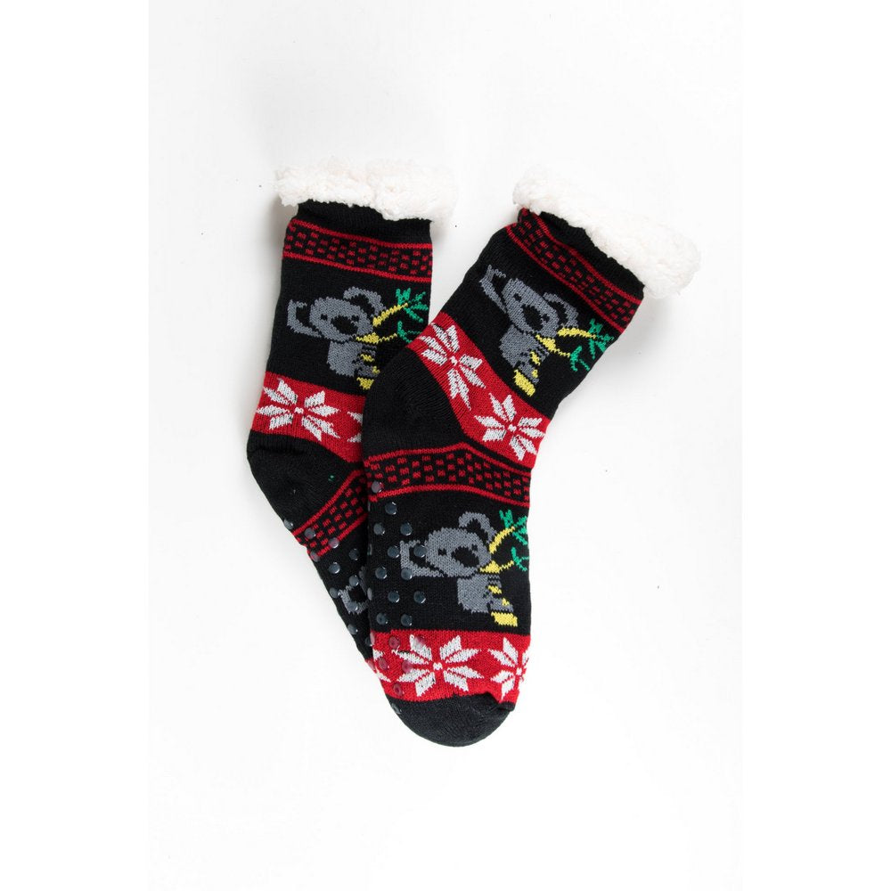 Cosy home socks for women with fluffy inner lining and non slip bottom in black koala print, flat lay showing print