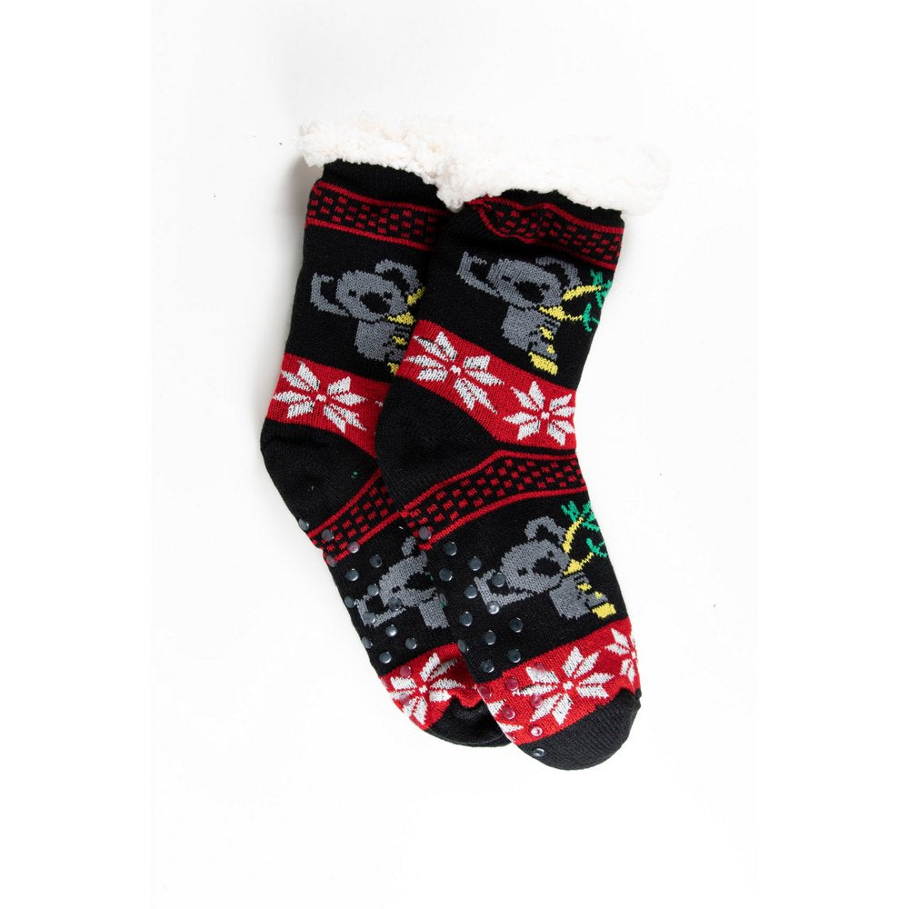 Cosy home socks for women with fluffy inner lining and non slip bottom in black koala print, flat lay showing length