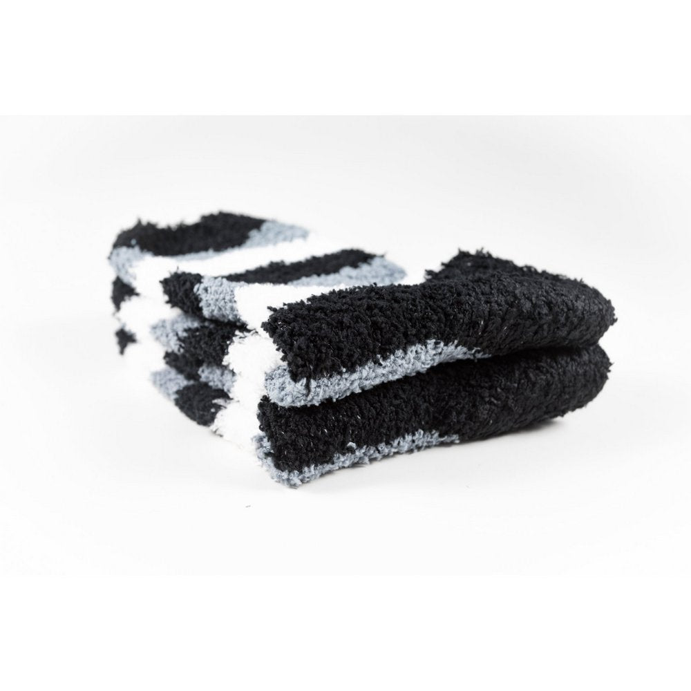 Cosy bed socks for women with non-slip bottoms in black grey stripes, close up of thickness