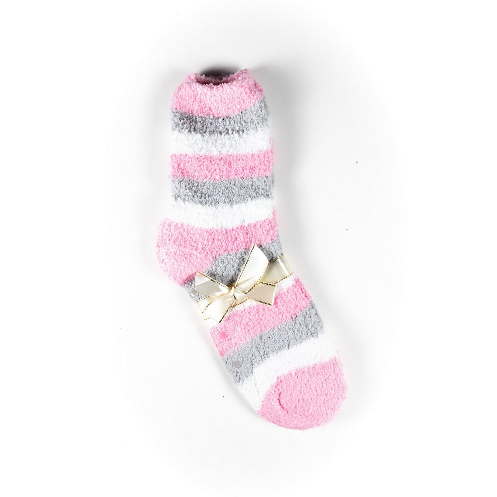 Cosy bed socks for women with non-slip bottoms in baby pink grey stripes, flat lay showing gift packaging with ribbon