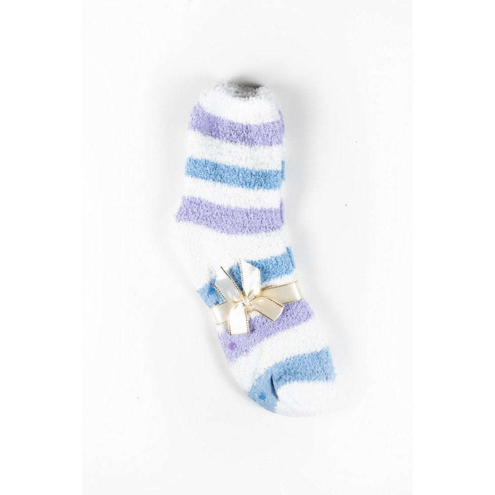 Cosy bed socks for women with non-slip bottoms in blue grey stripes, flat lay showing gift packaging with ribbon
